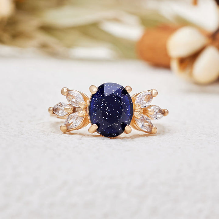 Anello Olivenorma con foglia di zircone in arenaria blu taglio ovale