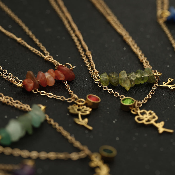 Collana con pietra portafortuna in pietra naturale Olivenorma con fiore di nascita