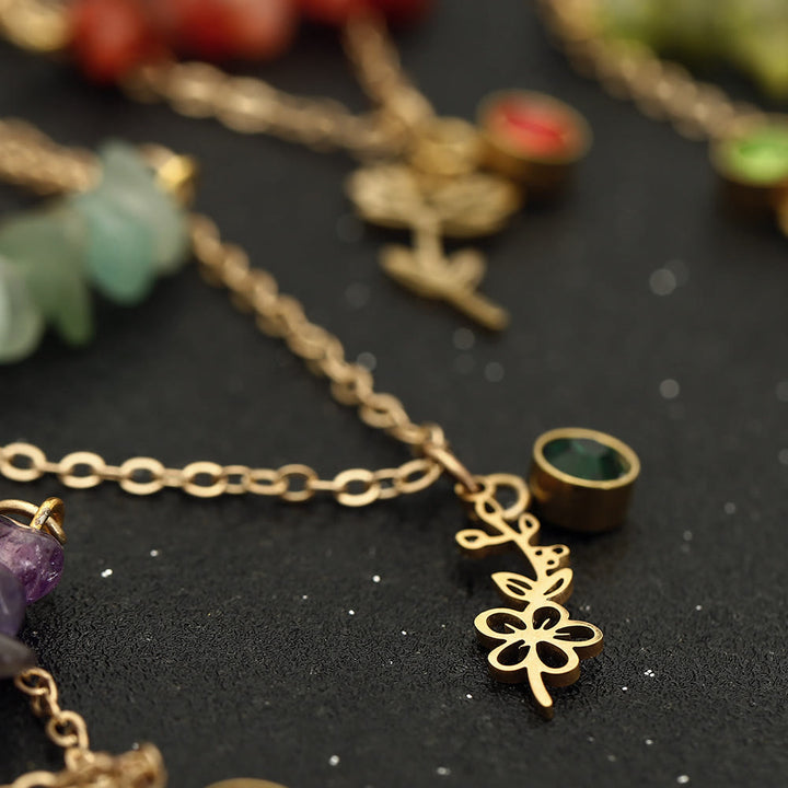 Collana con pietra portafortuna in pietra naturale Olivenorma con fiore di nascita