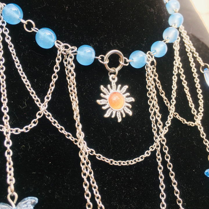 Collana girocollo a strati con farfalla solare in acquamarina Olivenorma