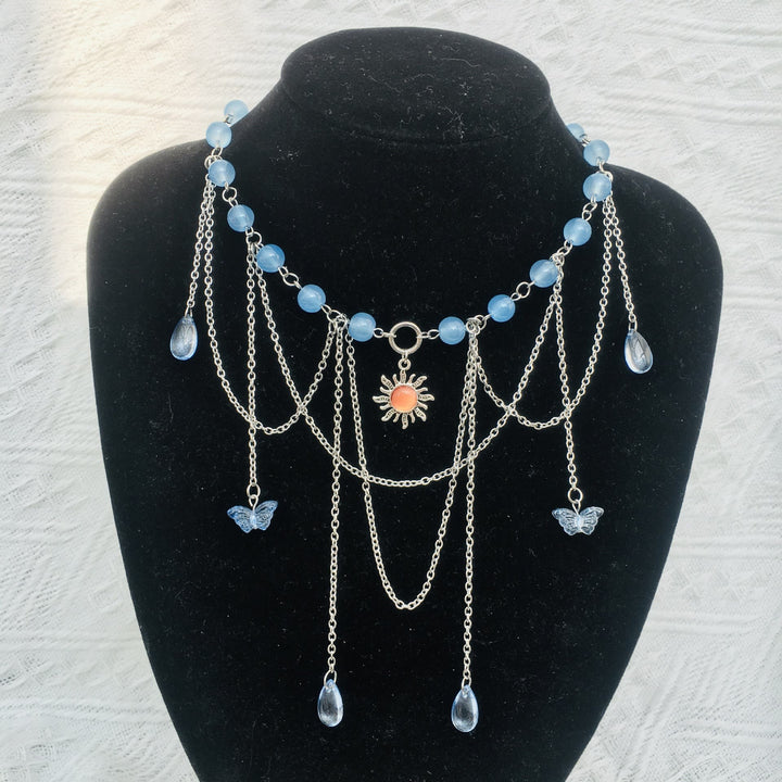 Collana girocollo a strati con farfalla solare in acquamarina Olivenorma