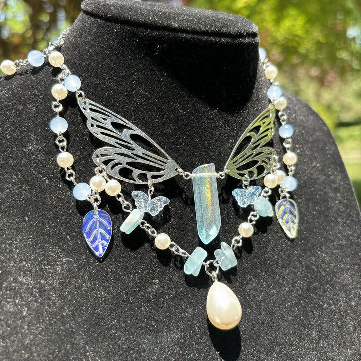 Collana girocollo a strati con ali di fata color acquamarina Olivenorma