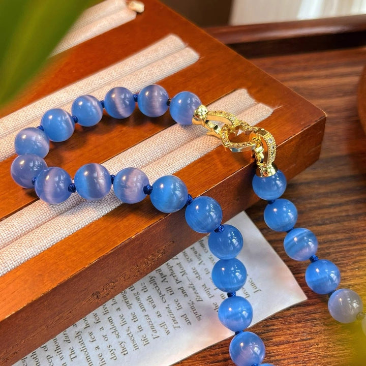 Collana di perline in pietra occhio di gatto blu Olivenorma