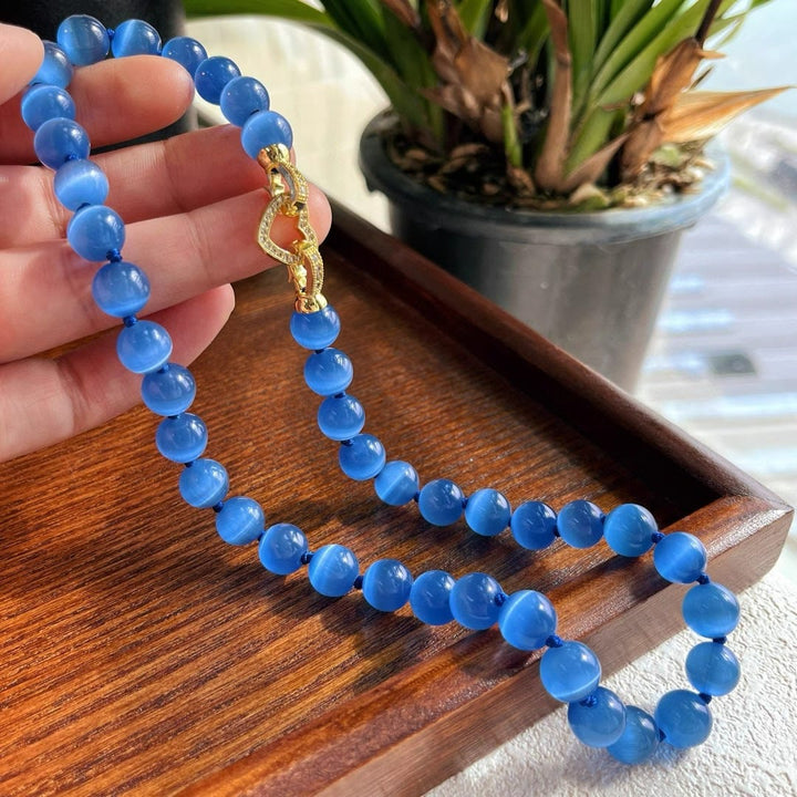 Collana di perline in pietra occhio di gatto blu Olivenorma