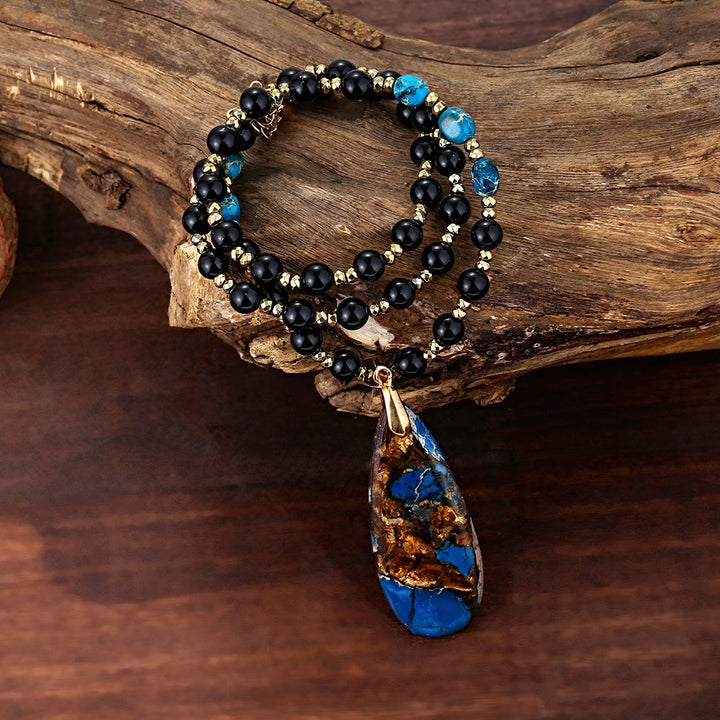 Collana con ciondolo in pietra blu dell'imperatore con perline di ossidiana Olivenorma