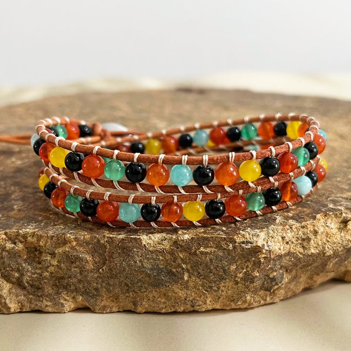 Olivenorma Bracciale intrecciato in corda di pelle con perline di pietra naturale