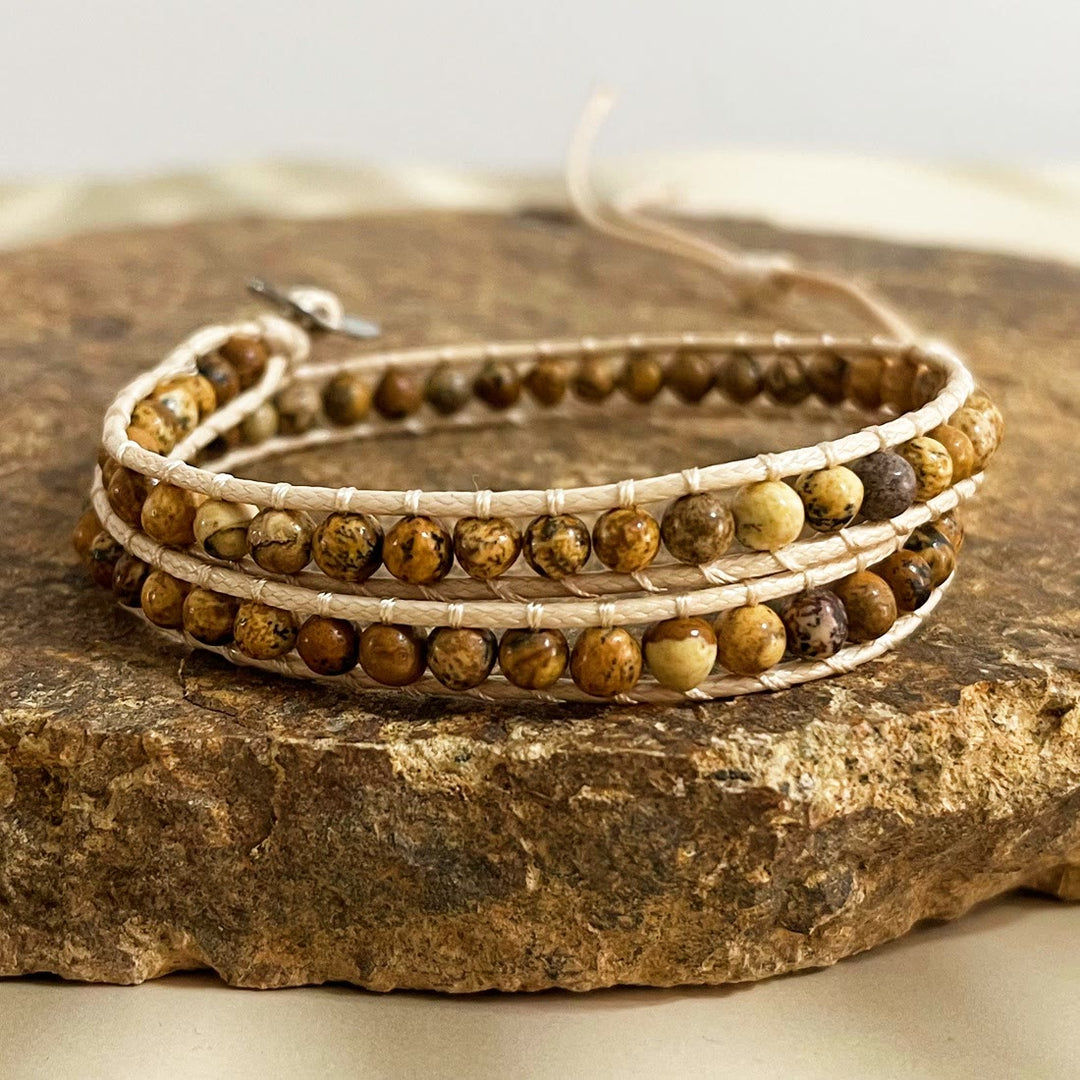Olivenorma Bracciale intrecciato in corda di pelle con perline di pietra naturale
