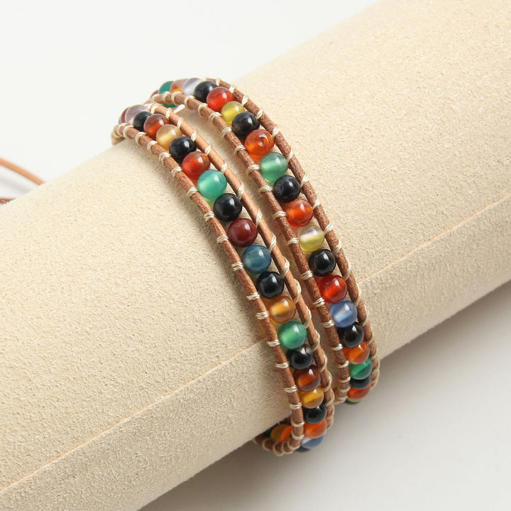 Olivenorma Bracciale intrecciato in corda di pelle con perline di pietra naturale