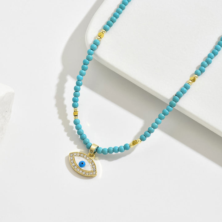 Collana con ciondolo a forma di malocchio con perline di cristallo naturale Olivenorma