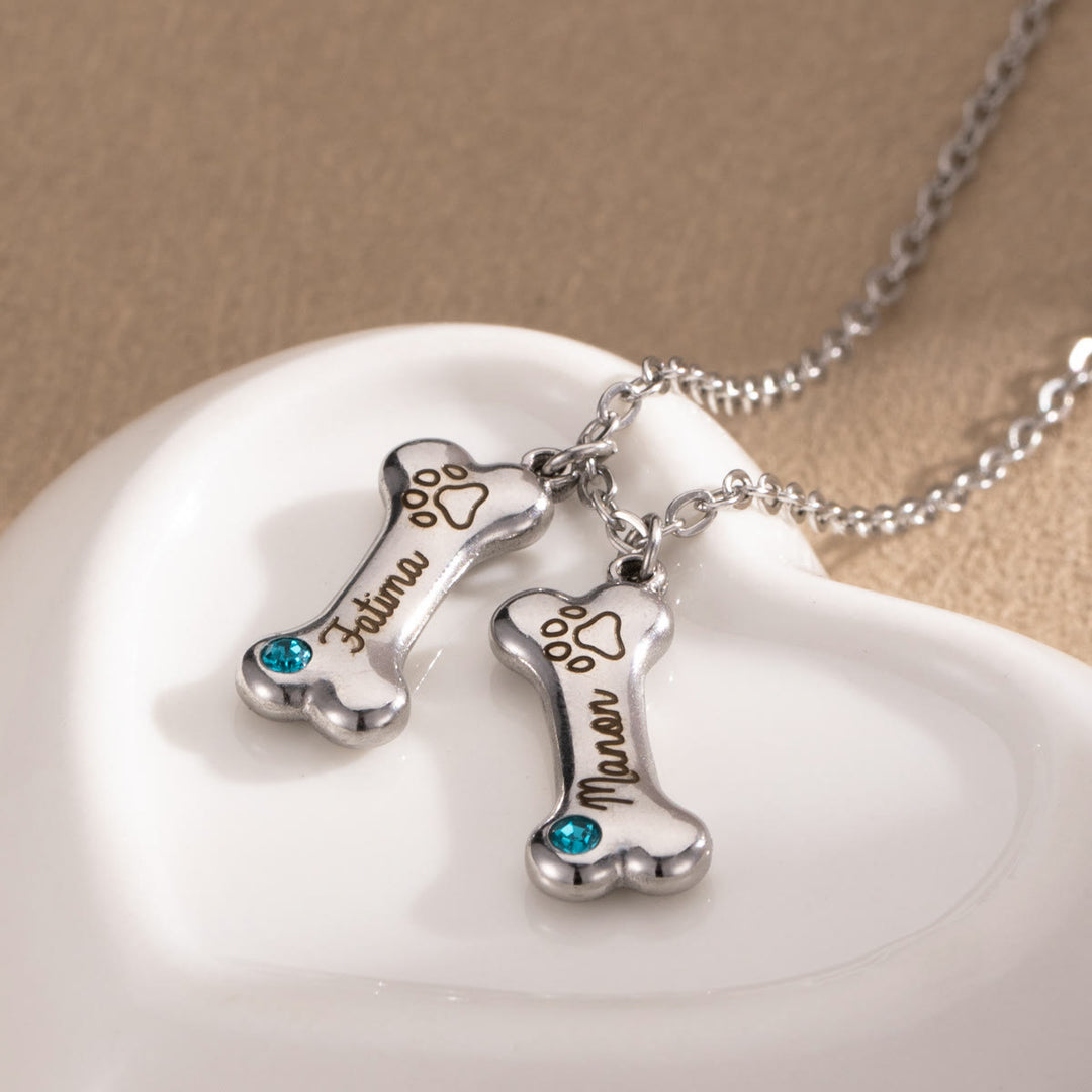 Collana personalizzata Olivenorma in acciaio inossidabile con pietra portafortuna a forma di osso di cane