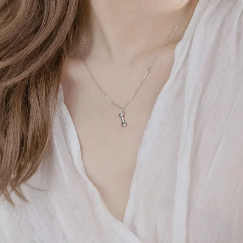 Collana personalizzata Olivenorma in acciaio inossidabile con pietra portafortuna a forma di osso di cane