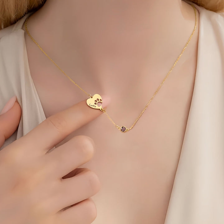 Collana personalizzata Olivenorma con pietra portafortuna a forma di cuore cavo e zampa di cane