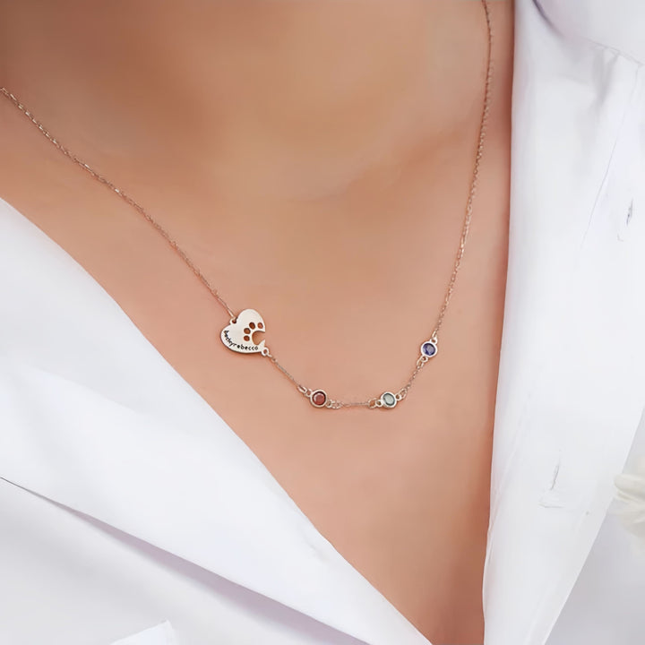 Collana personalizzata Olivenorma con pietra portafortuna a forma di cuore cavo e zampa di cane