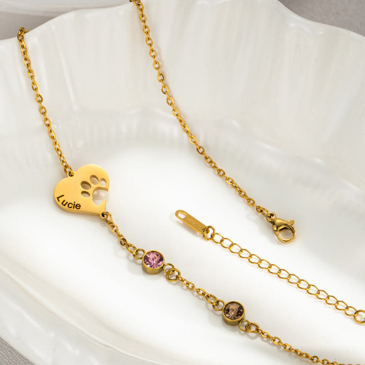 Collana personalizzata Olivenorma con pietra portafortuna a forma di cuore cavo e zampa di cane