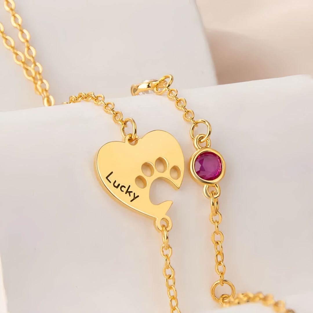Collana personalizzata Olivenorma con pietra portafortuna a forma di cuore cavo e zampa di cane