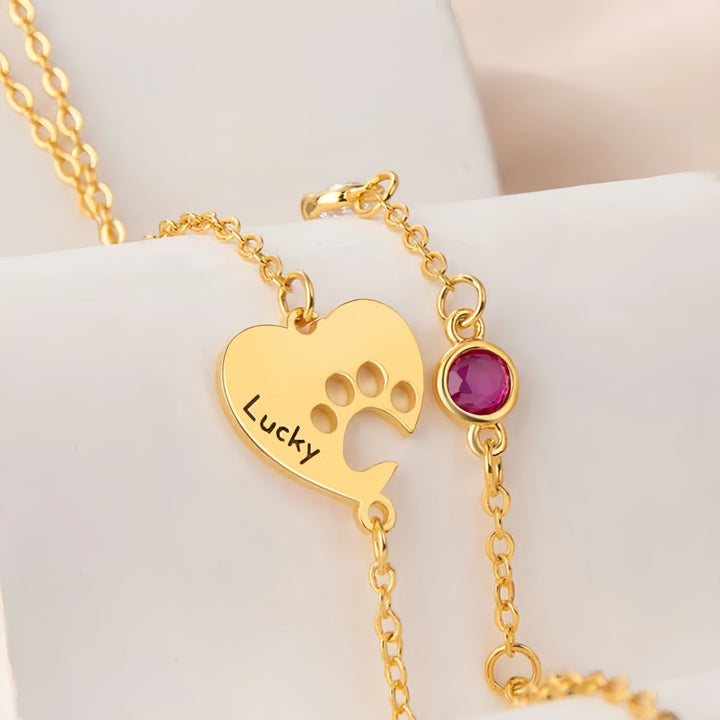 Collana personalizzata Olivenorma con pietra portafortuna a forma di cuore cavo e zampa di cane