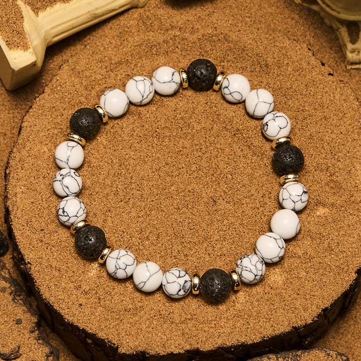 Bracciale Olivenorma con perline in pietra lavica naturale turchese bianco