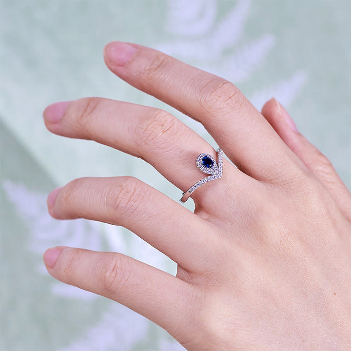 Anello Olivenorma con corona a goccia e topazio blu