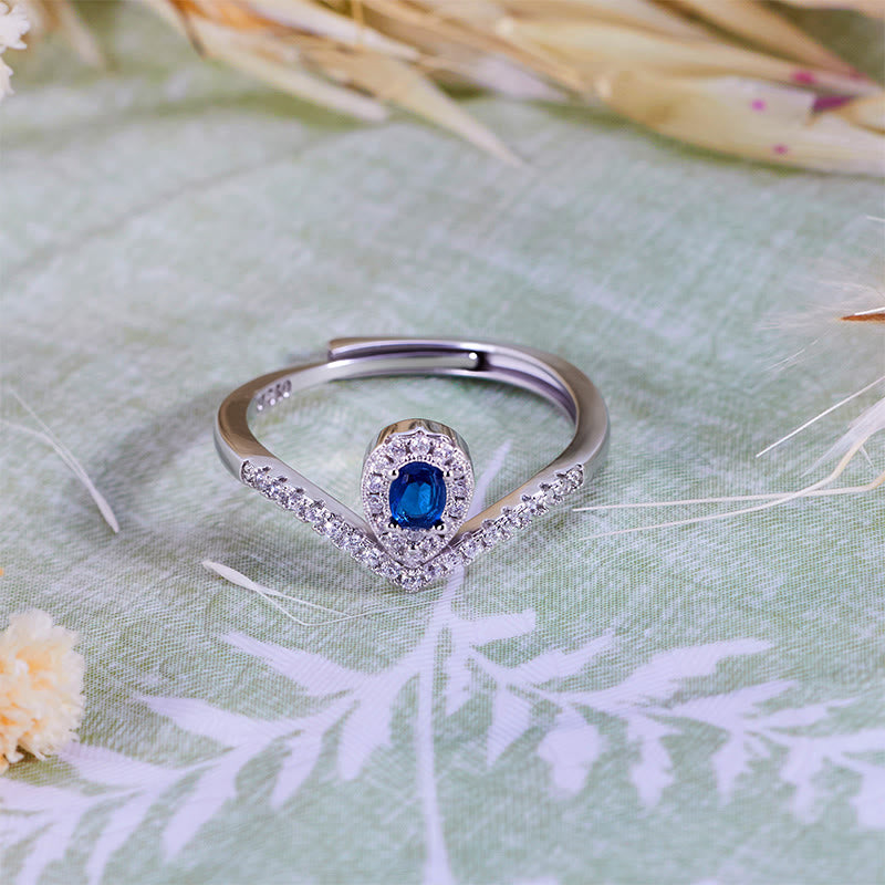 Anello Olivenorma con corona a goccia e topazio blu