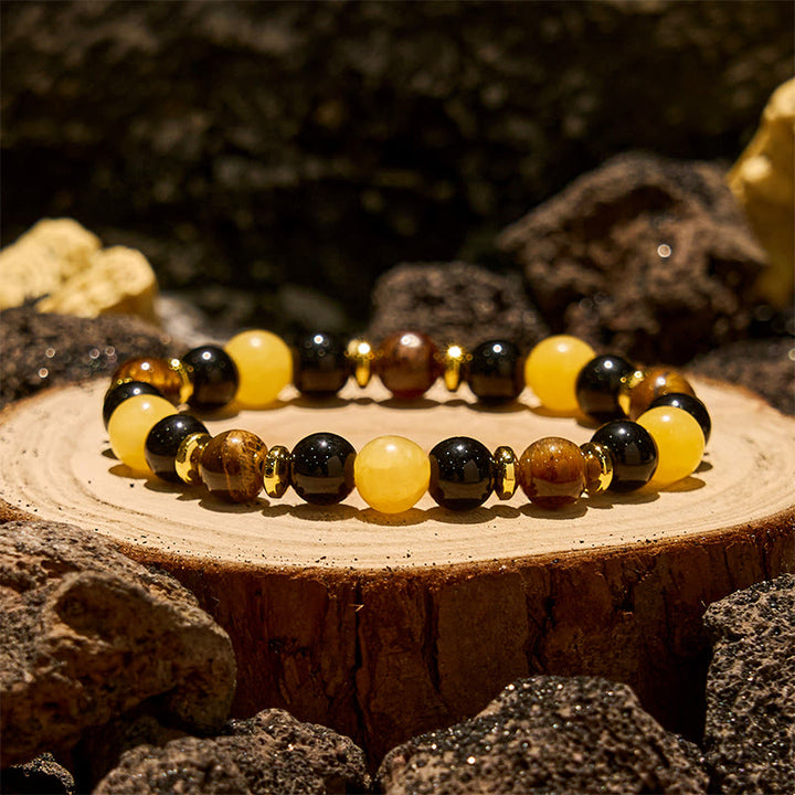 Bracciale Olivenorma con perline in ossidiana, occhio di tigre e avventurina gialla