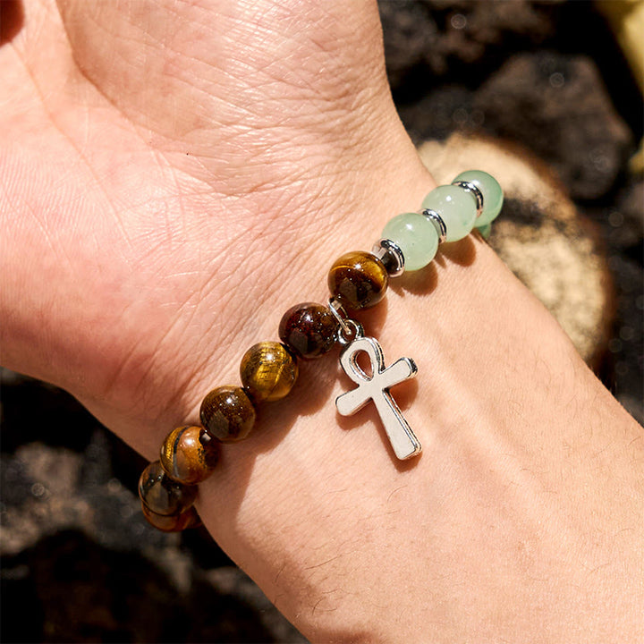 Bracciale Olivenorma con ciondolo a croce con perline in avventurina verde e occhio di tigre