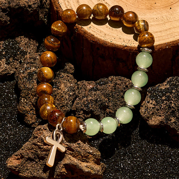 Bracciale Olivenorma con ciondolo a croce con perline in avventurina verde e occhio di tigre