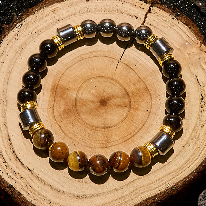 Bracciale Olivenorma con perle di ematite e ossidiana blu occhio di tigre