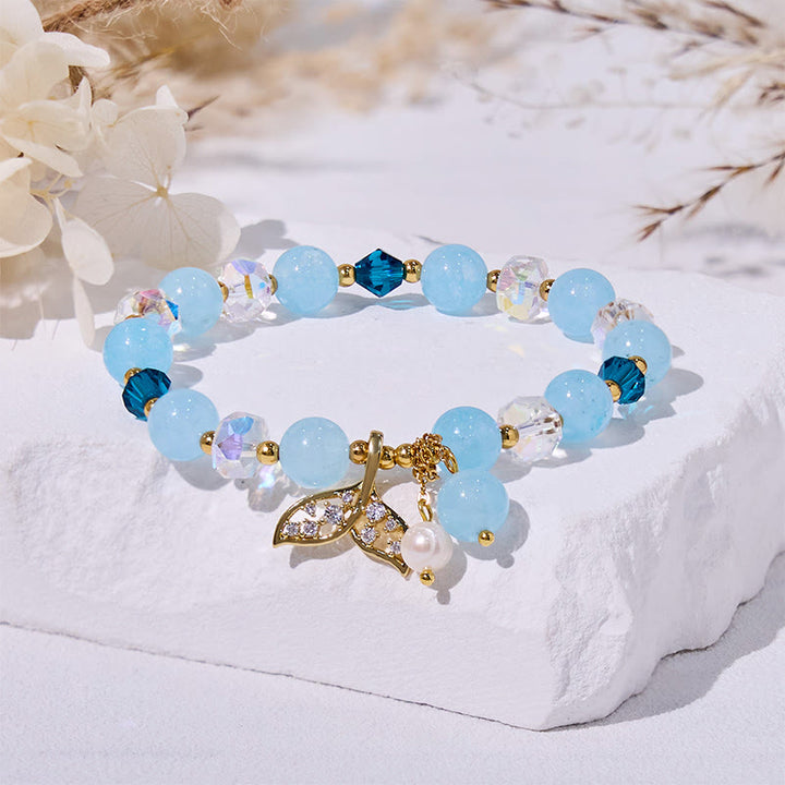Bracciale Olivenorma con perline di vetro trasparente e coda di balena in acquamarina