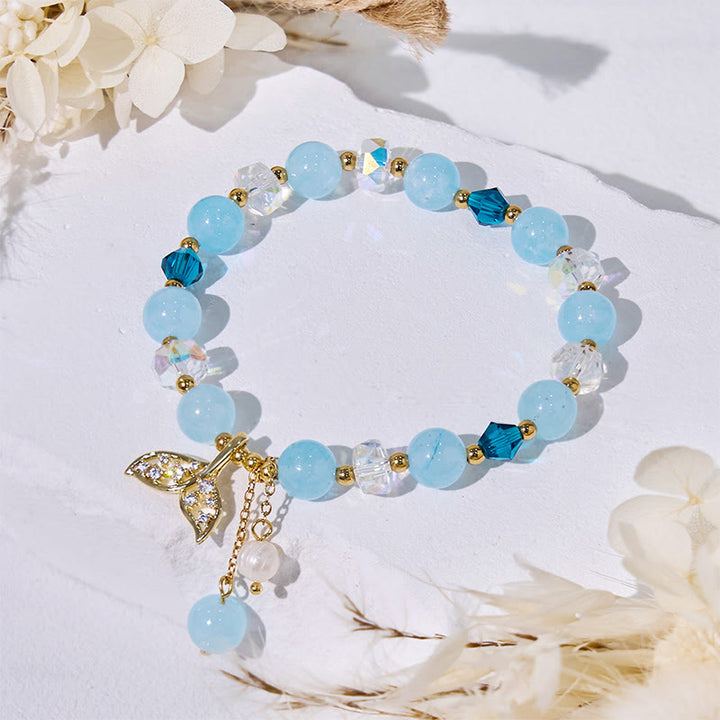 Bracciale Olivenorma con perline di vetro trasparente e coda di balena in acquamarina