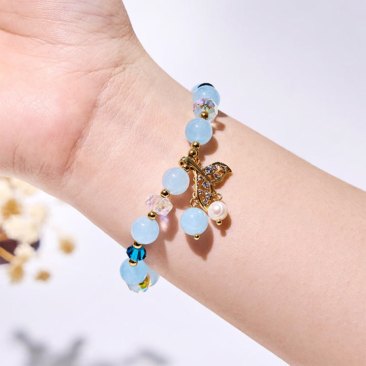 Bracciale Olivenorma con perline di vetro trasparente e coda di balena in acquamarina