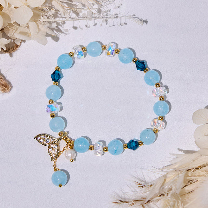 Bracciale Olivenorma con perline di vetro trasparente e coda di balena in acquamarina