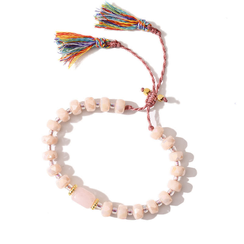 Bracciale intrecciato con pietre preziose e nappe glitterate in stile boho di Olivenorma - Quarzo rosa + smalto rosa - image 1