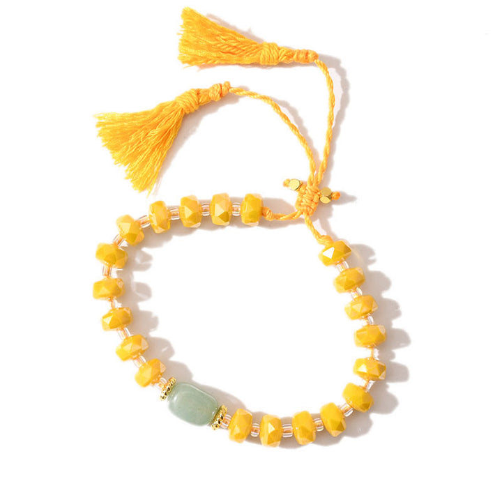 Bracciale intrecciato con pietre preziose e nappe glitterate in stile boho di Olivenorma - Avventurina verde + smalto giallo - image 18