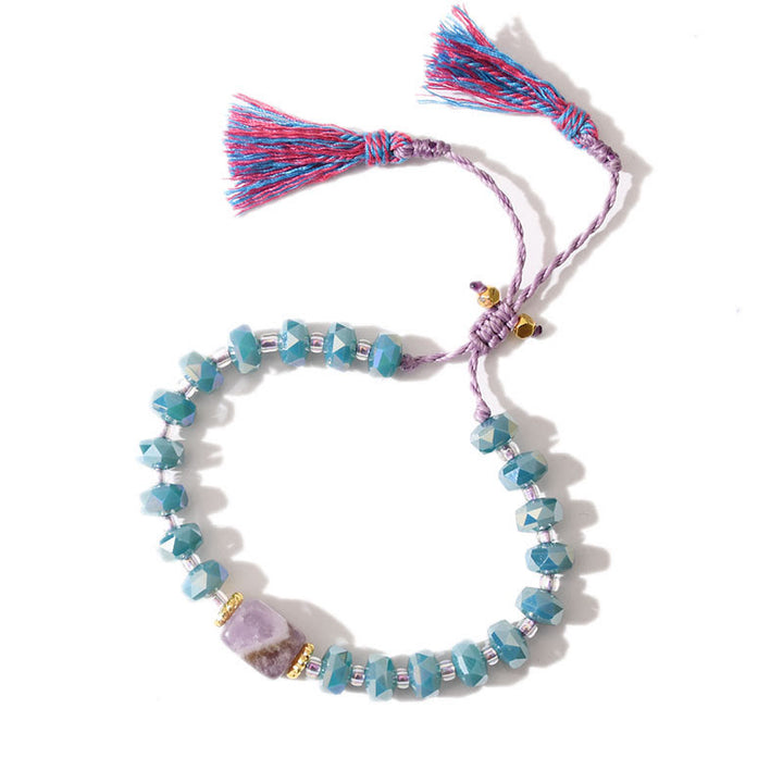 Bracciale intrecciato con pietre preziose e nappe glitterate in stile boho di Olivenorma - Lepidolite + Galze Blu - image 12