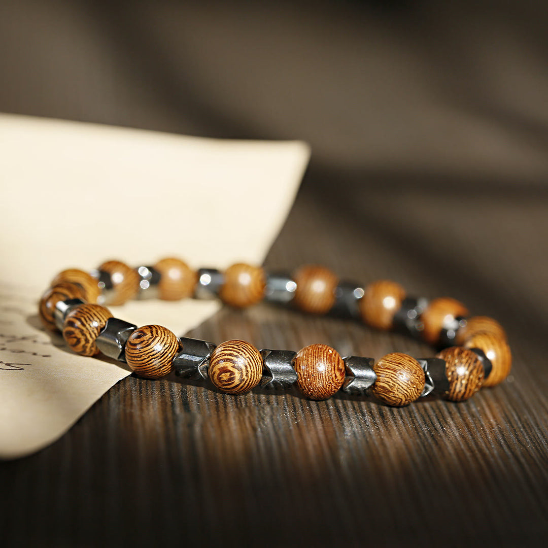 Braccialetto elasticizzato con perline di ematite e pietra lavica Olivenorma da 8 mm - Ematite + Perline di Legno - image 8