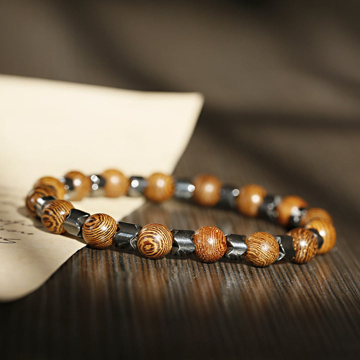 Braccialetto elasticizzato con perline di ematite e pietra lavica Olivenorma da 8 mm - Ematite + Perline di Legno - image 8