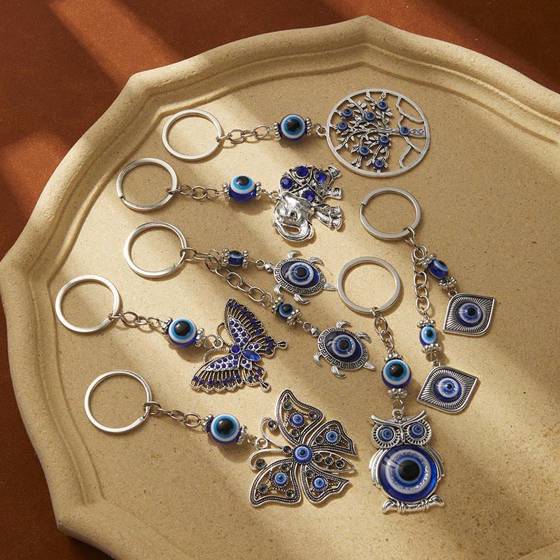 Portachiavi creativo Olivenorma con occhio malvagio blu e dettagli di animali/piante - Tartaruga - image 0