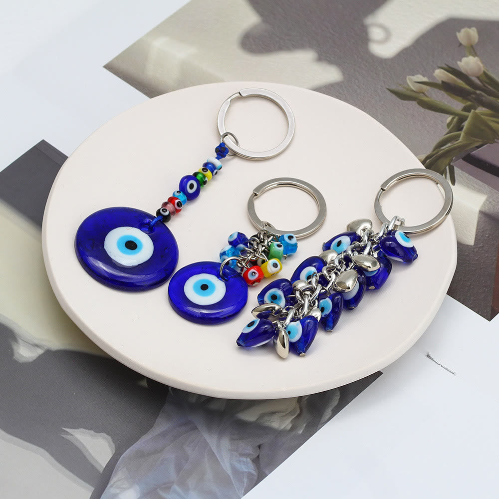 Portachiavi Olivenorma con cuore blu vibrante e occhio malvagio con più ciondoli - image 0