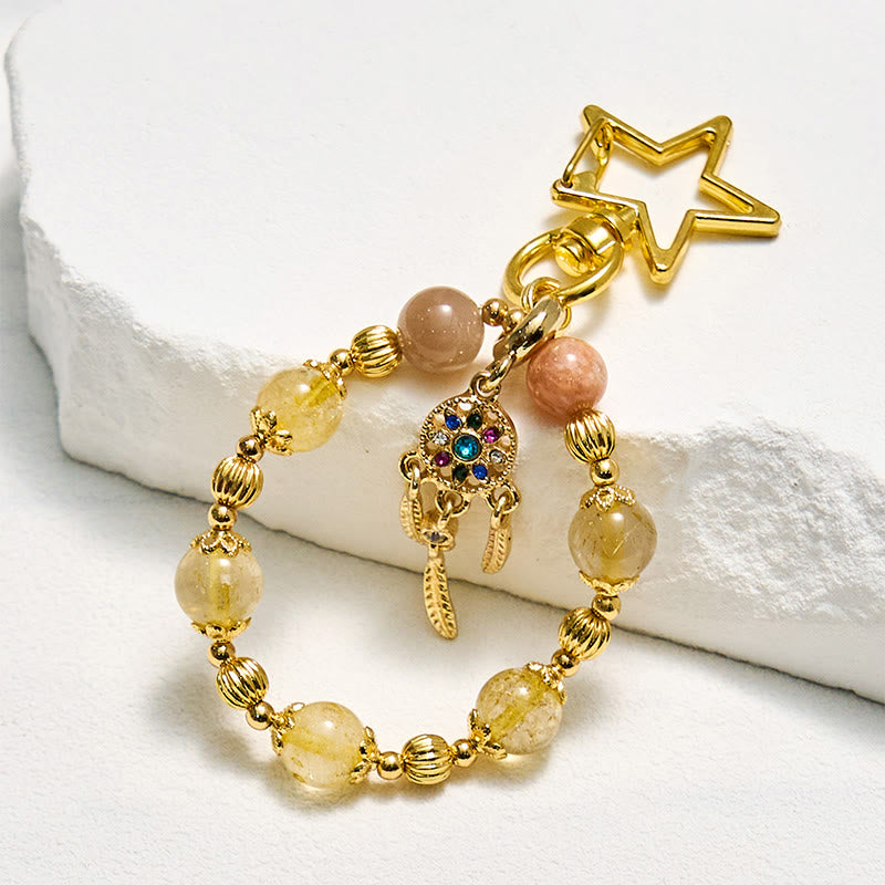 Portachiavi con cinturino per telefono in cristallo di quarzo rutilato dorato e pietra del sole Olivenorma - Pietra del sole e quarzo rutilato dorato - image 0