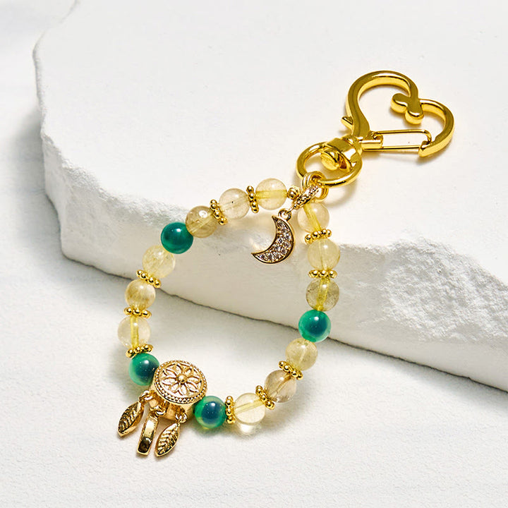 Portachiavi Olivenorma in agata caramella e quarzo rutilato dorato con cinturino per telefono - Agata caramella e quarzo rutilato oro - image 0