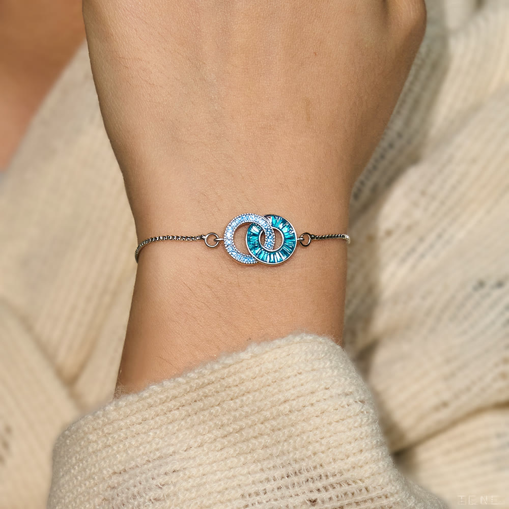 Regali personalizzati con pietra portafortuna Olivenorma per madre e figlia: bracciale e collana con cerchi intrecciati. - image 5
