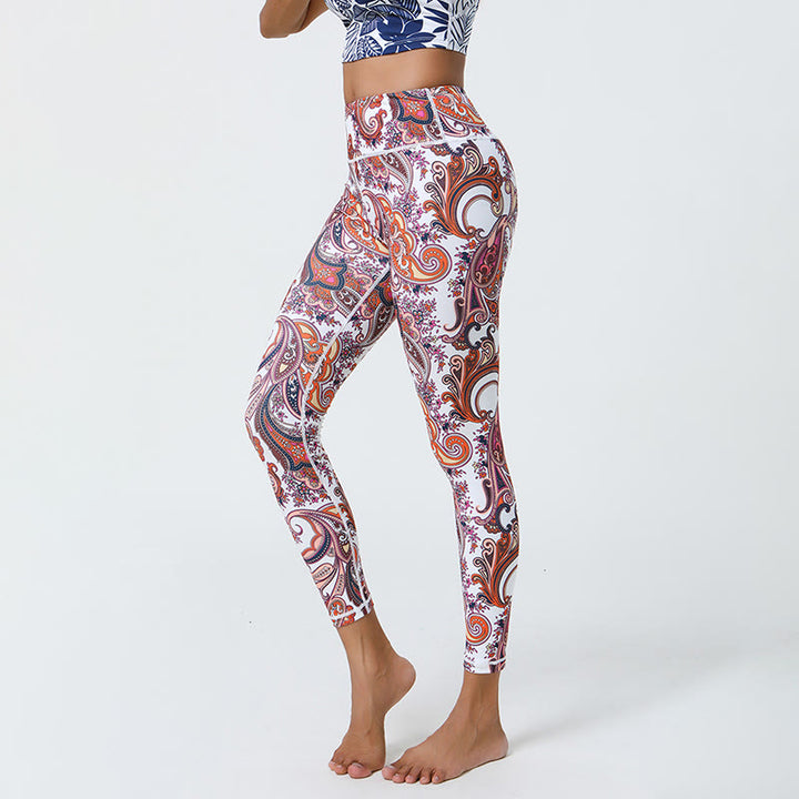 Pantaloni da yoga Olivenorma a vita alta con stampa paisley vivace - image 0