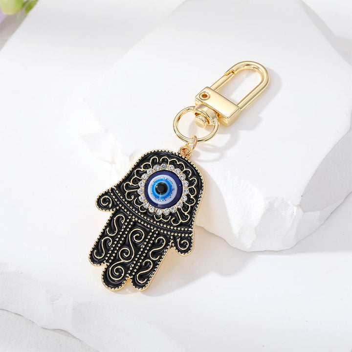 Ciondolo a forma di chiave Hamsa con occhio di Allah e strass intarsiati, Olivenorma - Nero - image 7