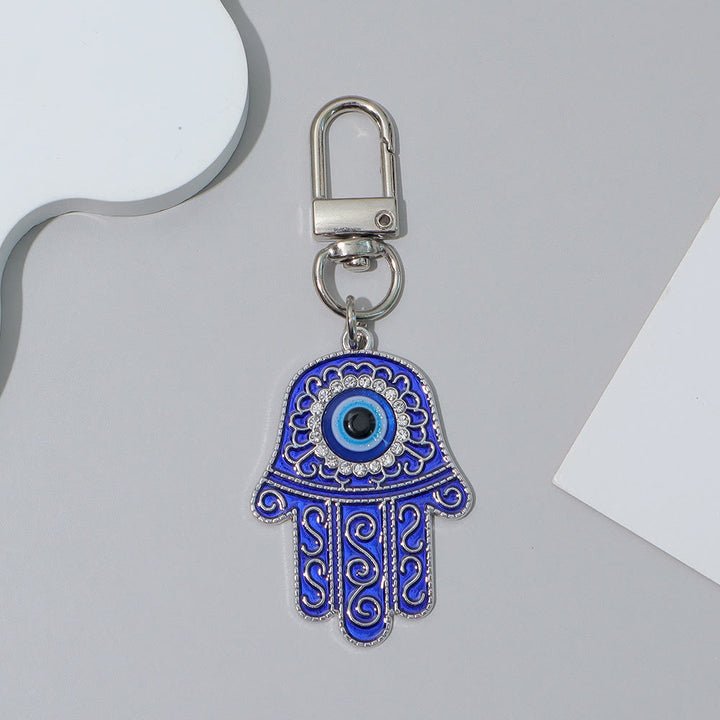 Ciondolo a forma di chiave Hamsa con occhio di Allah e strass intarsiati, Olivenorma - Blu e argento - image 11