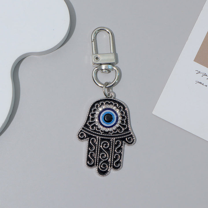 Ciondolo a forma di chiave Hamsa con occhio di Allah e strass intarsiati, Olivenorma - Nero e argento - image 12