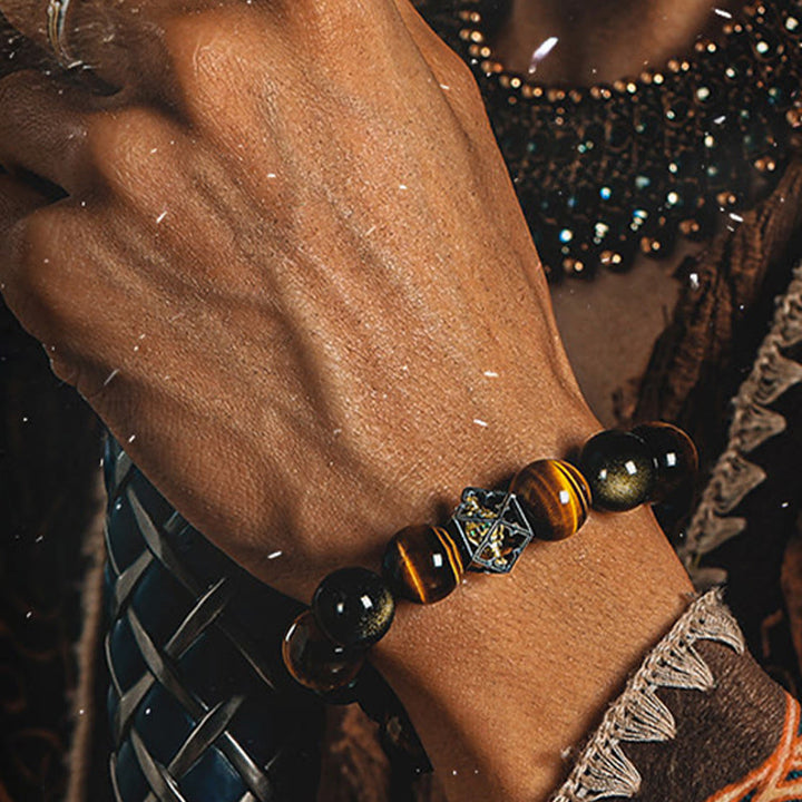 Bracciale Olivenorma con ciondoli di geometria sacra in occhio di tigre e ossidiana dorata. - image 3
