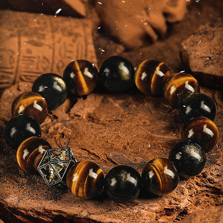 Bracciale Olivenorma con ciondoli di geometria sacra in occhio di tigre e ossidiana dorata. - image 1