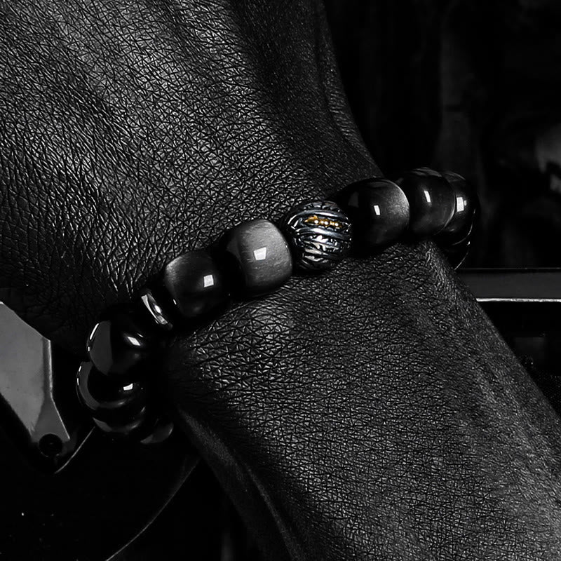Bracciale Olivenorma con ciondolo a forma di simbolo attorcigliato inciso in ossidiana argentata. - image 4