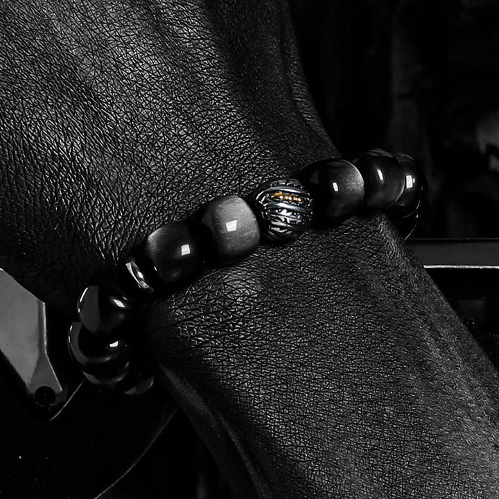 Bracciale Olivenorma con ciondolo a forma di simbolo attorcigliato inciso in ossidiana argentata. - image 4