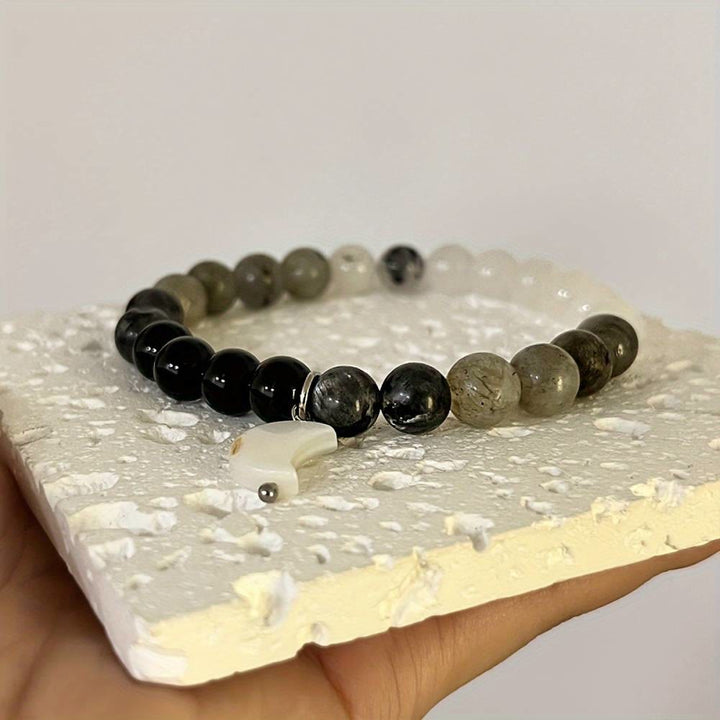 Bracciale Olivenorma con perline di cristallo trasparente, ossidiana, labradorite e pietra di luna nera. - image 5